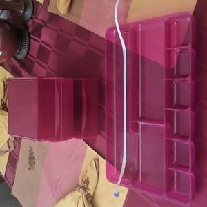 Plastic tray with double drawer for storage.